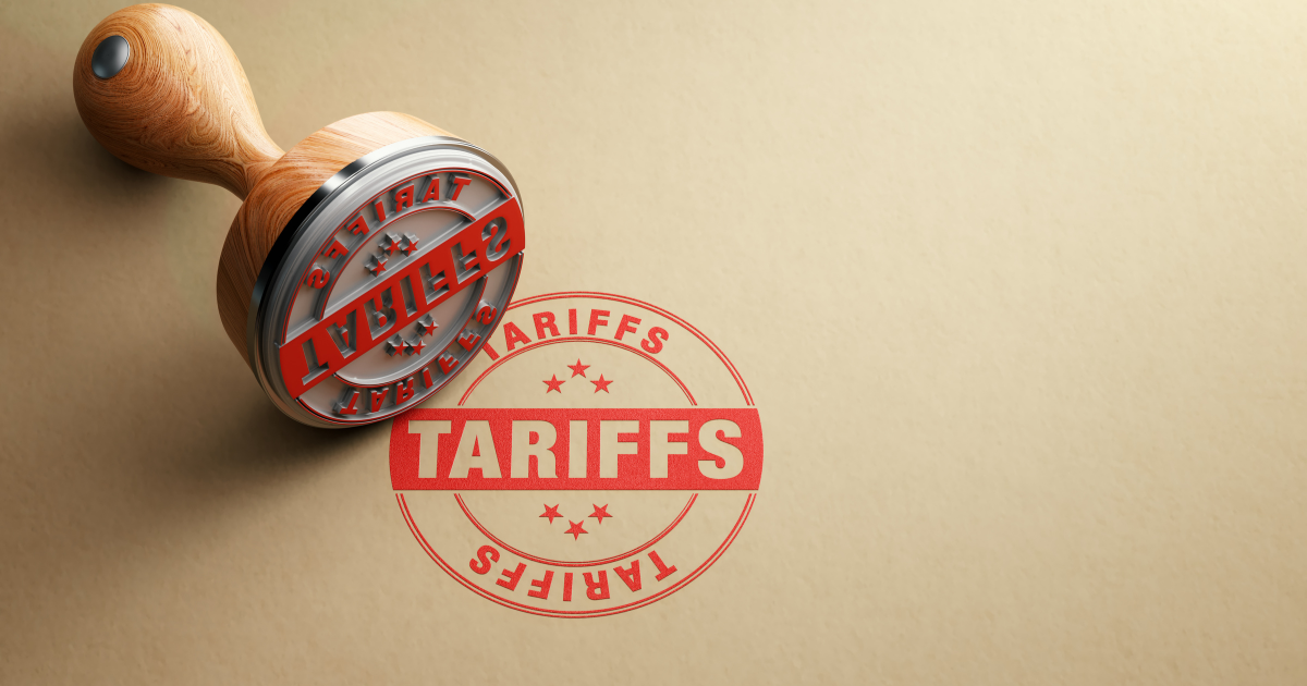 Wooden tariffs stamp is sitting on recycled paper background. Horizontal composition with selective focus and copy space.