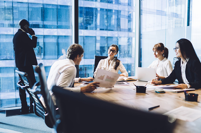 Image of a student wearing a backpack and smiling at the camera