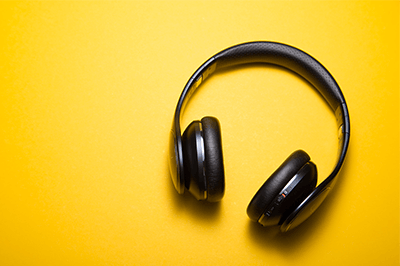 Image of headphones on yellow background